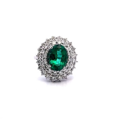 Anello con Smeraldo Ovale e Doppio Contorno di Diamanti Naturali in Oro Bianco