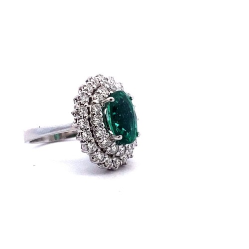 Anello con Smeraldo Ovale e Doppio Contorno di Diamanti Naturali in Oro Bianco